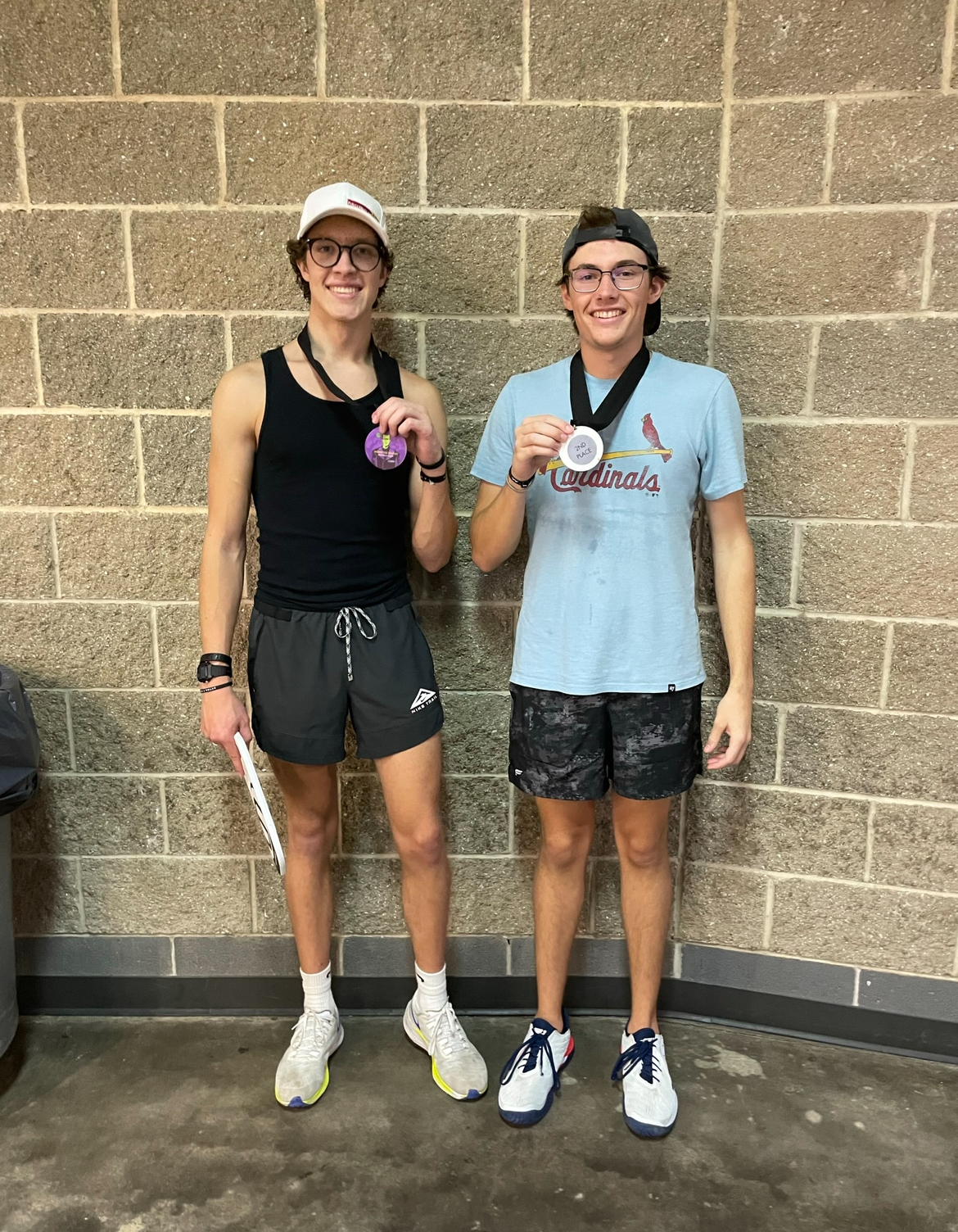 Two players with medals after a tournament match