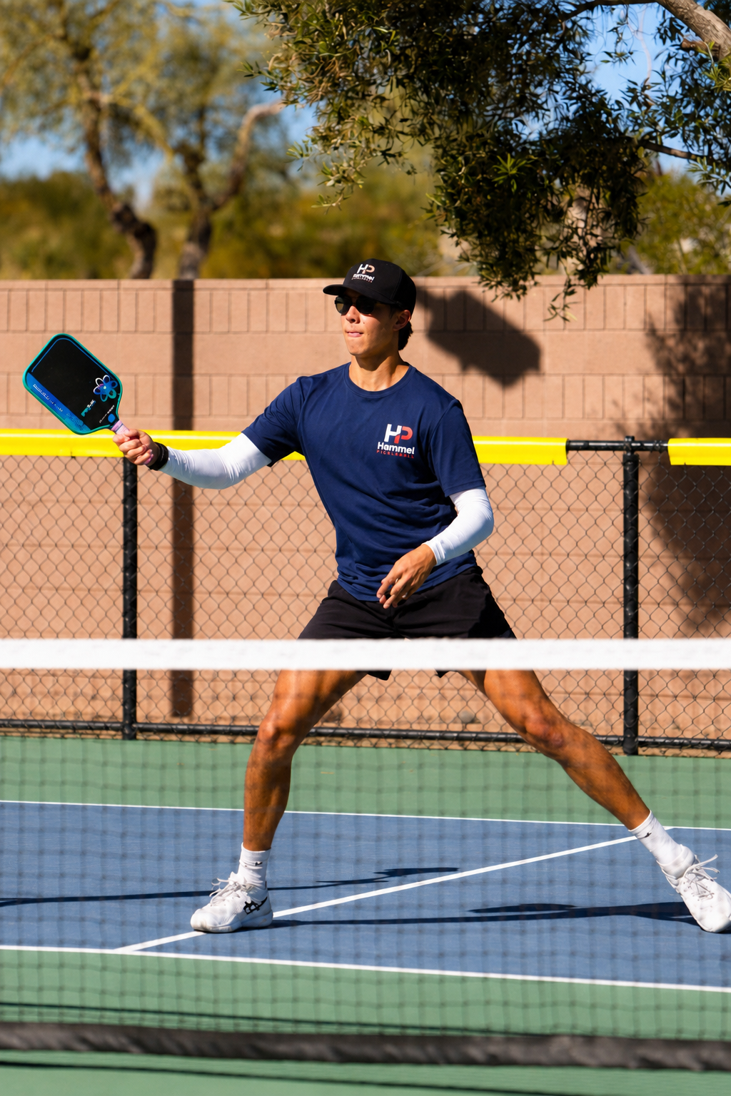 Kevin Hammel ripping a forehand on an outdoor court